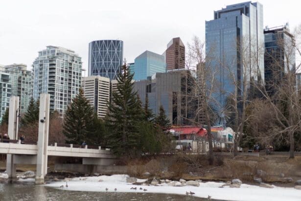 Winter view of Calgary skyline from riverfront park.