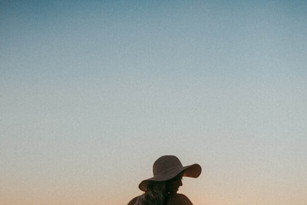 Woman enjoying sunset at a tranquil Toronto beach.