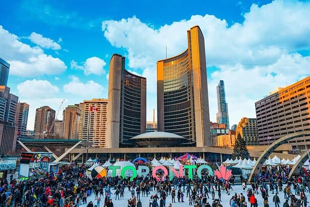 Vibrant Toronto city festival with bustling crowd and skyline.