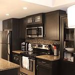 Modern kitchen interior in Bow Valley condo.