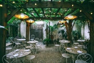 Enchanted garden-style dining area with fairy lights.