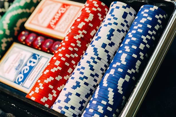 Assorted casino chips in a case.