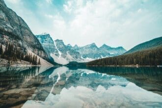 Tranquil Canadian Rockies reflecting in a crystal-clear mountain lake.