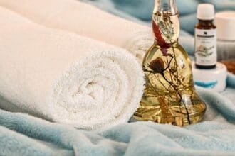 Relaxing Spa Day Essentials with Towels and Oils