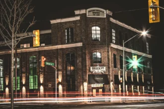 Nighttime exterior view of Brook Street Brewing Company building.